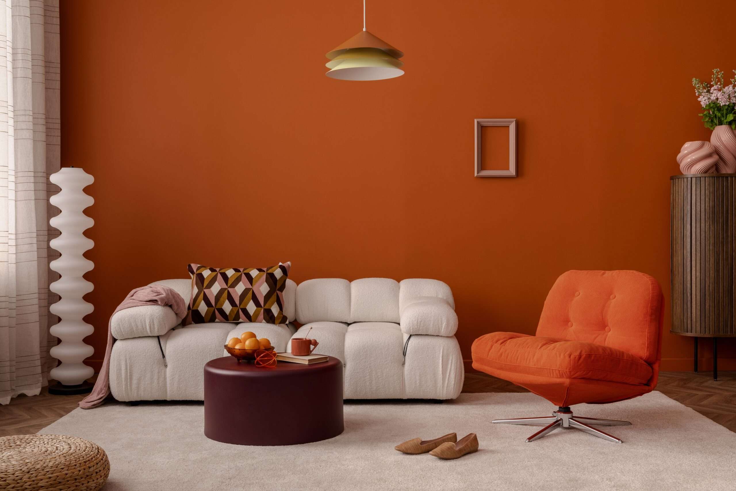 Warm,modern,living,room,with,burnt,orange,walls,,soft,white